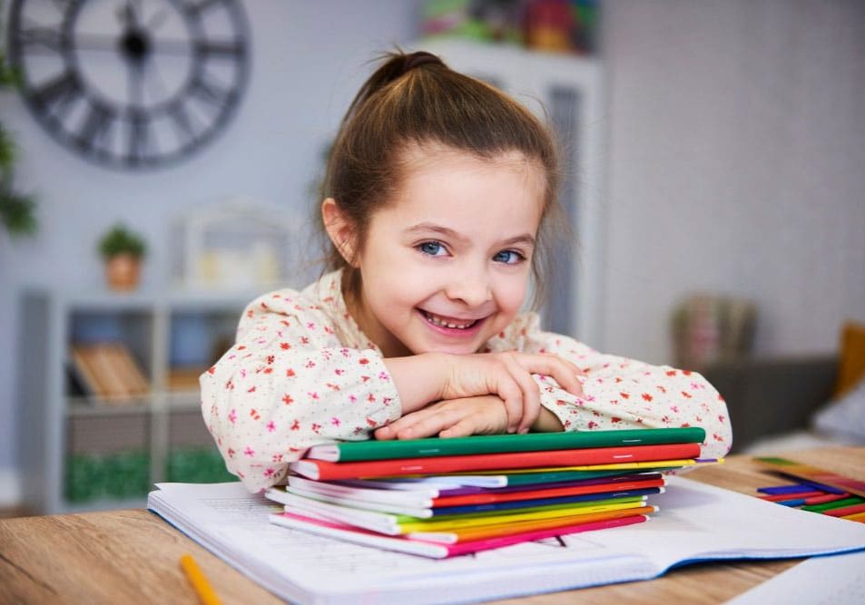 smiling-girl-studying-home